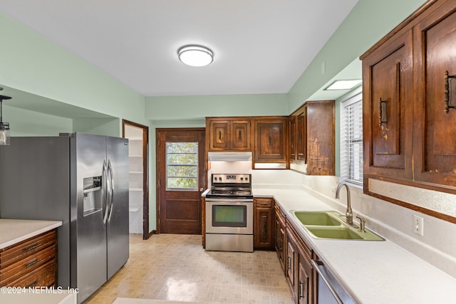 kitchen with sink and appliances with stainless steel finishes