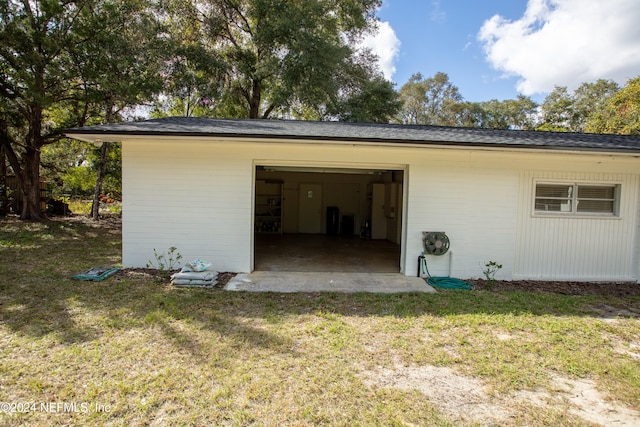 garage with a lawn