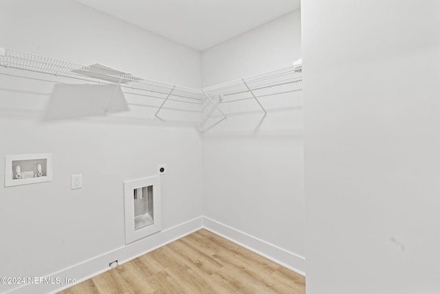 laundry room featuring hardwood / wood-style flooring, hookup for an electric dryer, and washer hookup