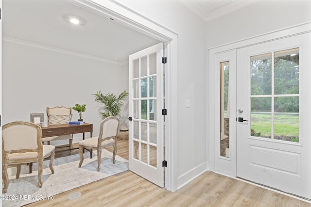 entryway featuring light hardwood / wood-style floors and ornamental molding