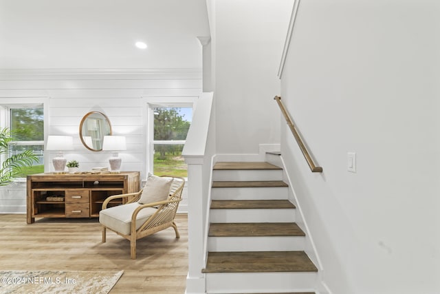 stairs with hardwood / wood-style flooring