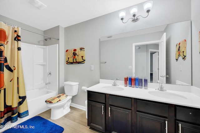 full bathroom featuring vanity, hardwood / wood-style flooring, toilet, and shower / bathtub combination with curtain