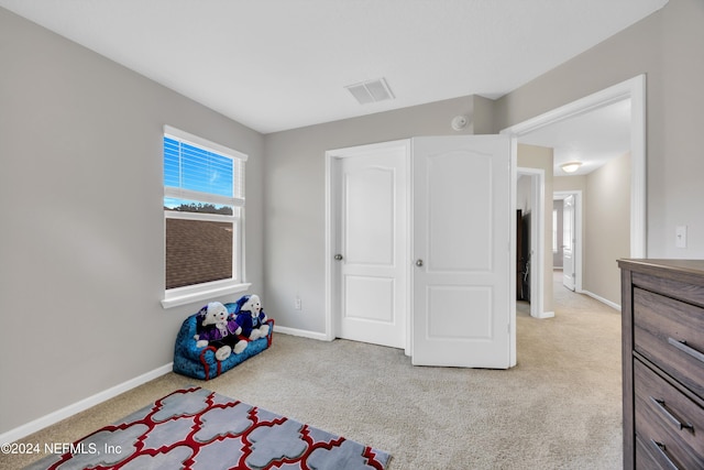 bedroom with light carpet