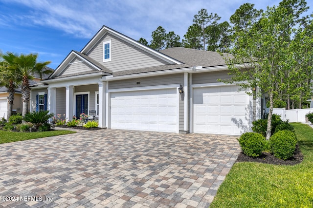 view of front of property with a garage