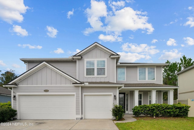 view of front of home featuring a front yard and a garage