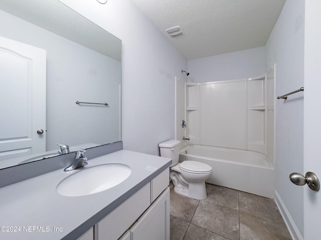 full bathroom with vanity, toilet, shower / tub combination, and a textured ceiling