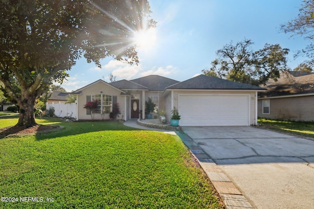 ranch-style house with a front yard and a garage