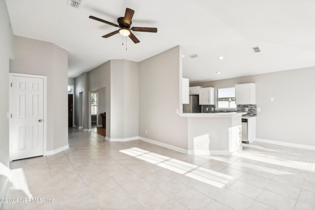 unfurnished living room with light tile patterned floors and ceiling fan