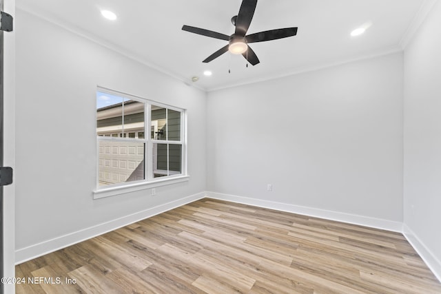 empty room featuring crown molding, ceiling fan, and light hardwood / wood-style floors