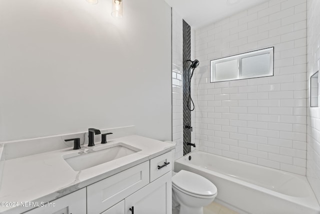 full bathroom featuring vanity, toilet, and tiled shower / bath combo