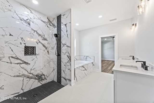 bathroom with vanity, wood-type flooring, and plus walk in shower