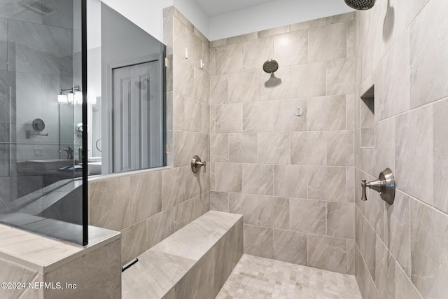 bathroom with a tile shower