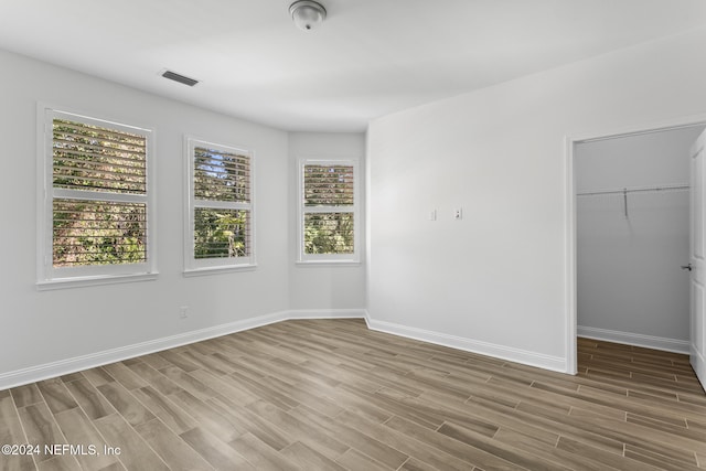 unfurnished room featuring wood-type flooring