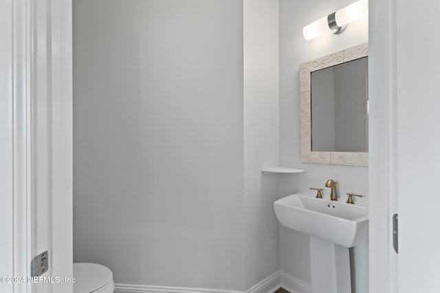 bathroom with sink and toilet