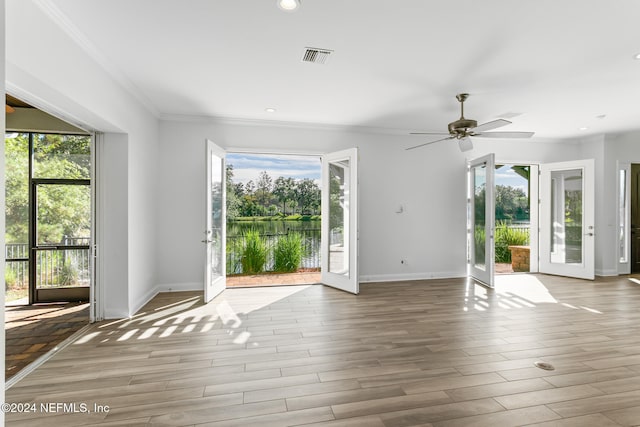 interior space featuring plenty of natural light, light wood-type flooring, and french doors