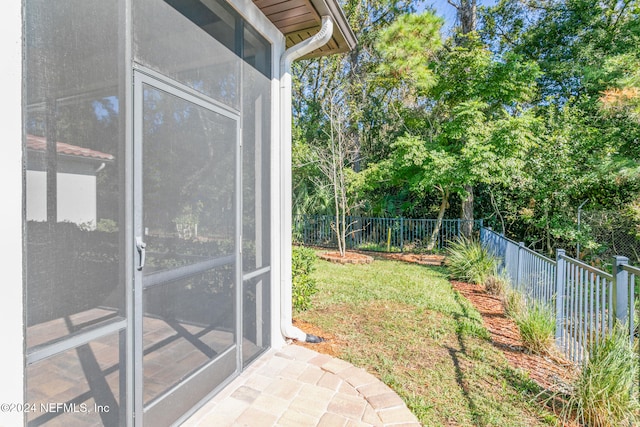 view of yard with a sunroom