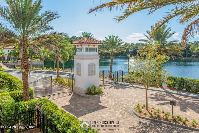 surrounding community with a water view