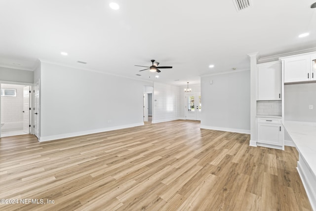 unfurnished living room with ornamental molding, ceiling fan, and light hardwood / wood-style flooring