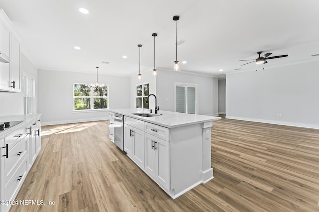 kitchen with sink, decorative light fixtures, dishwasher, an island with sink, and white cabinets