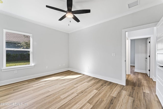 unfurnished room with ceiling fan, ornamental molding, and light hardwood / wood-style flooring