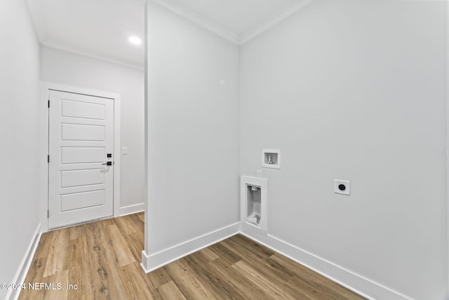 laundry room with electric dryer hookup, hardwood / wood-style floors, and ornamental molding