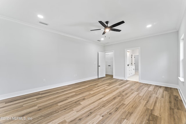 unfurnished bedroom featuring ornamental molding, ceiling fan, ensuite bath, and light hardwood / wood-style flooring