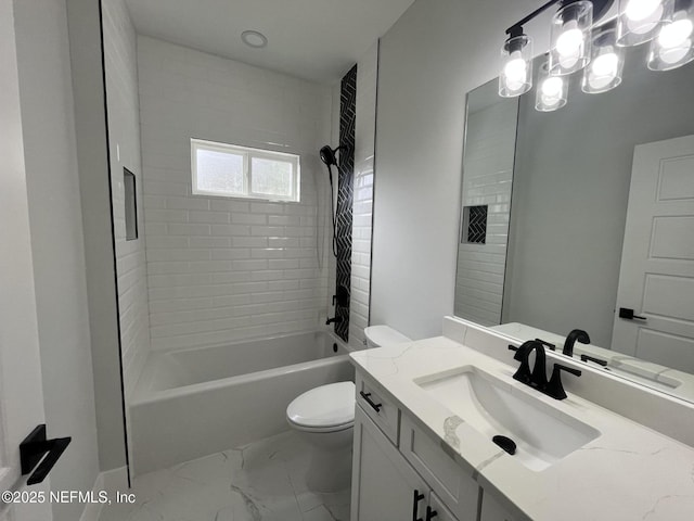 full bathroom with tiled shower / bath, vanity, and toilet