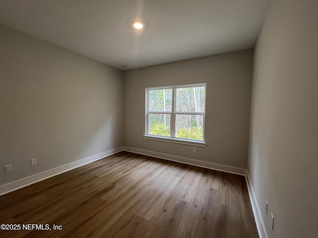 spare room featuring hardwood / wood-style floors