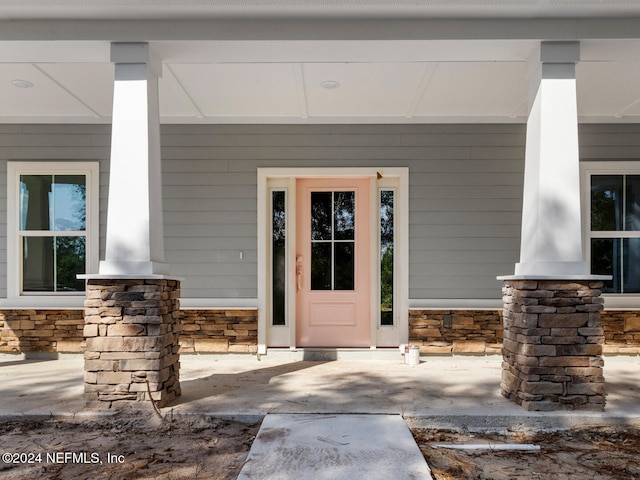 entrance to property with a porch