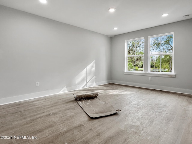 spare room featuring hardwood / wood-style flooring