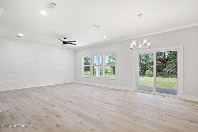 unfurnished room with light hardwood / wood-style flooring, ceiling fan with notable chandelier, and ornamental molding