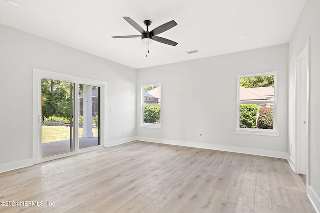 unfurnished room with ceiling fan, plenty of natural light, and light hardwood / wood-style floors