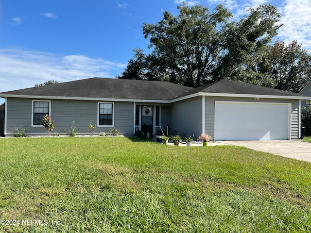 ranch-style home with a front yard and a garage