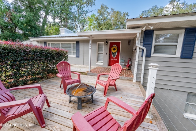 deck with an outdoor fire pit