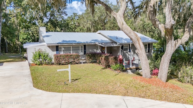 ranch-style house with a front lawn