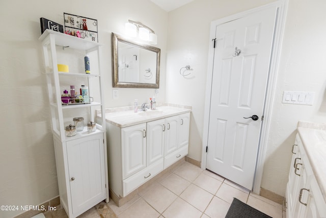 bathroom featuring tile patterned flooring and vanity