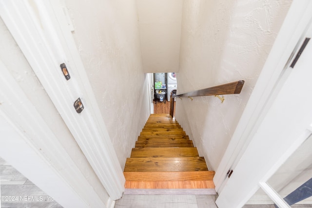 stairway featuring hardwood / wood-style flooring