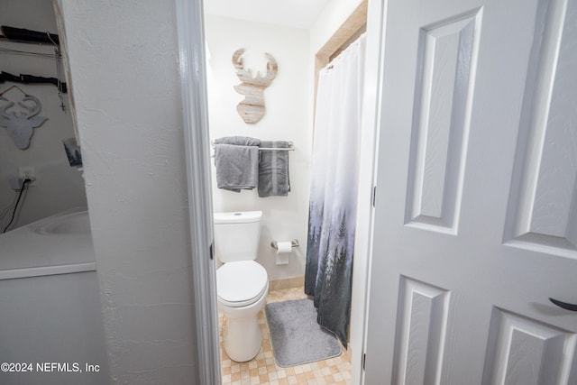 bathroom featuring toilet