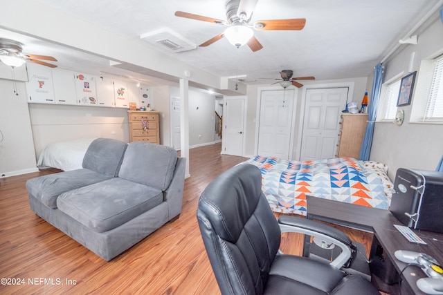 bedroom featuring ceiling fan and light hardwood / wood-style floors