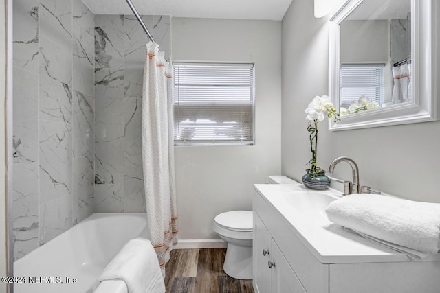 full bathroom with vanity, toilet, wood-type flooring, and shower / bath combo