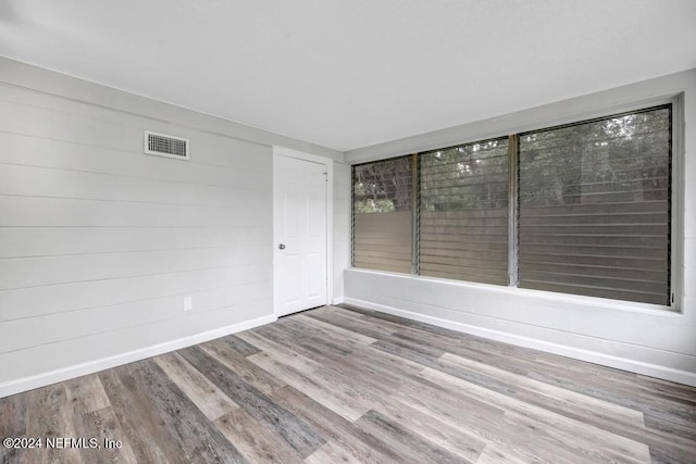 spare room featuring hardwood / wood-style flooring