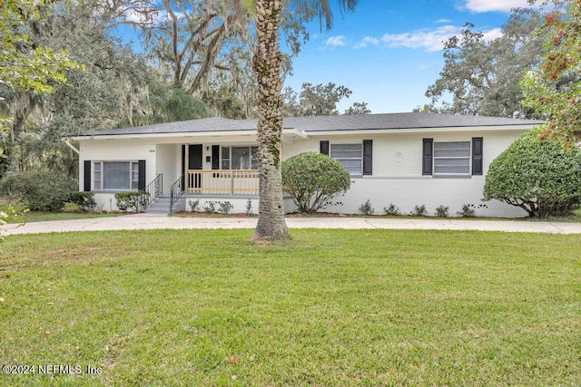 single story home with a porch and a front yard