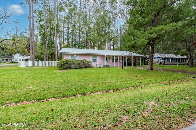 single story home featuring a front yard