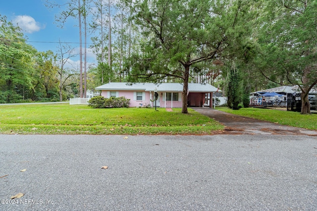 ranch-style house with a front lawn