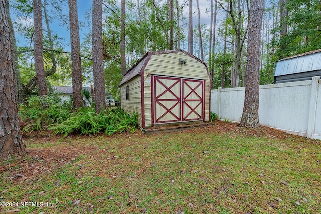 view of outbuilding with a lawn