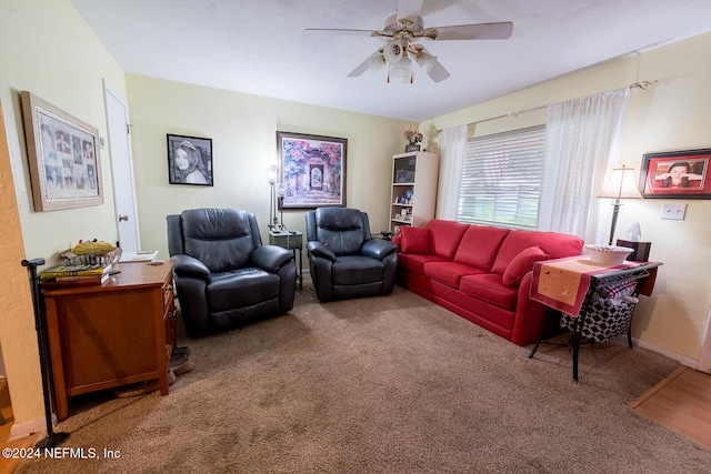 carpeted living room featuring ceiling fan