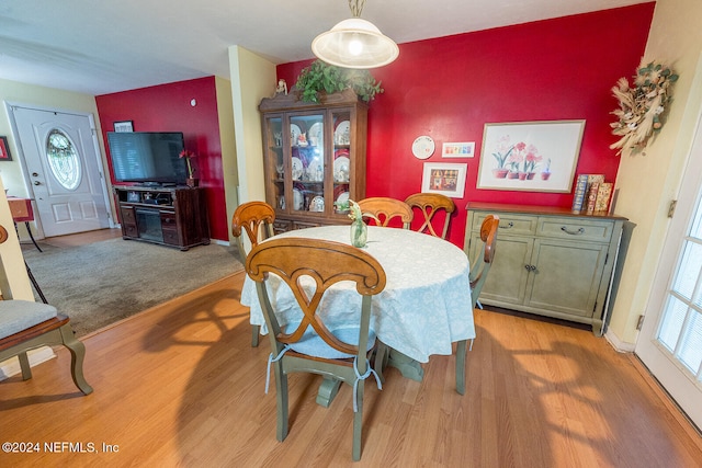 dining area with light hardwood / wood-style floors