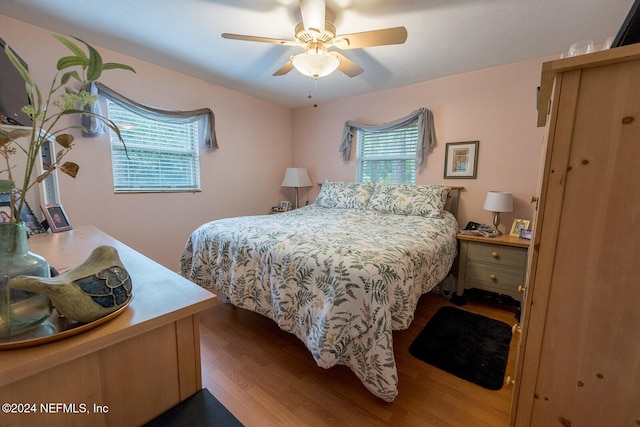 bedroom with ceiling fan and light hardwood / wood-style flooring