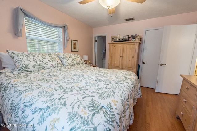 bedroom featuring light hardwood / wood-style floors and ceiling fan