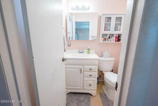 bathroom with vanity and toilet